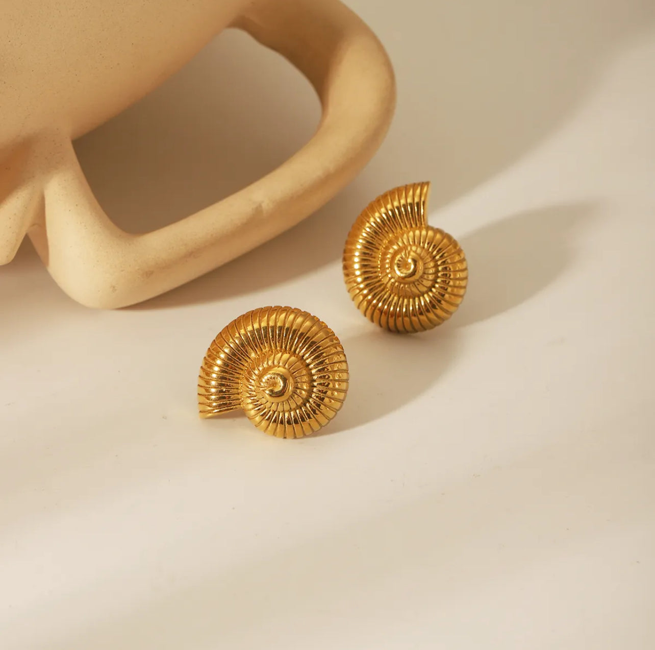 Sea snail stud earrings